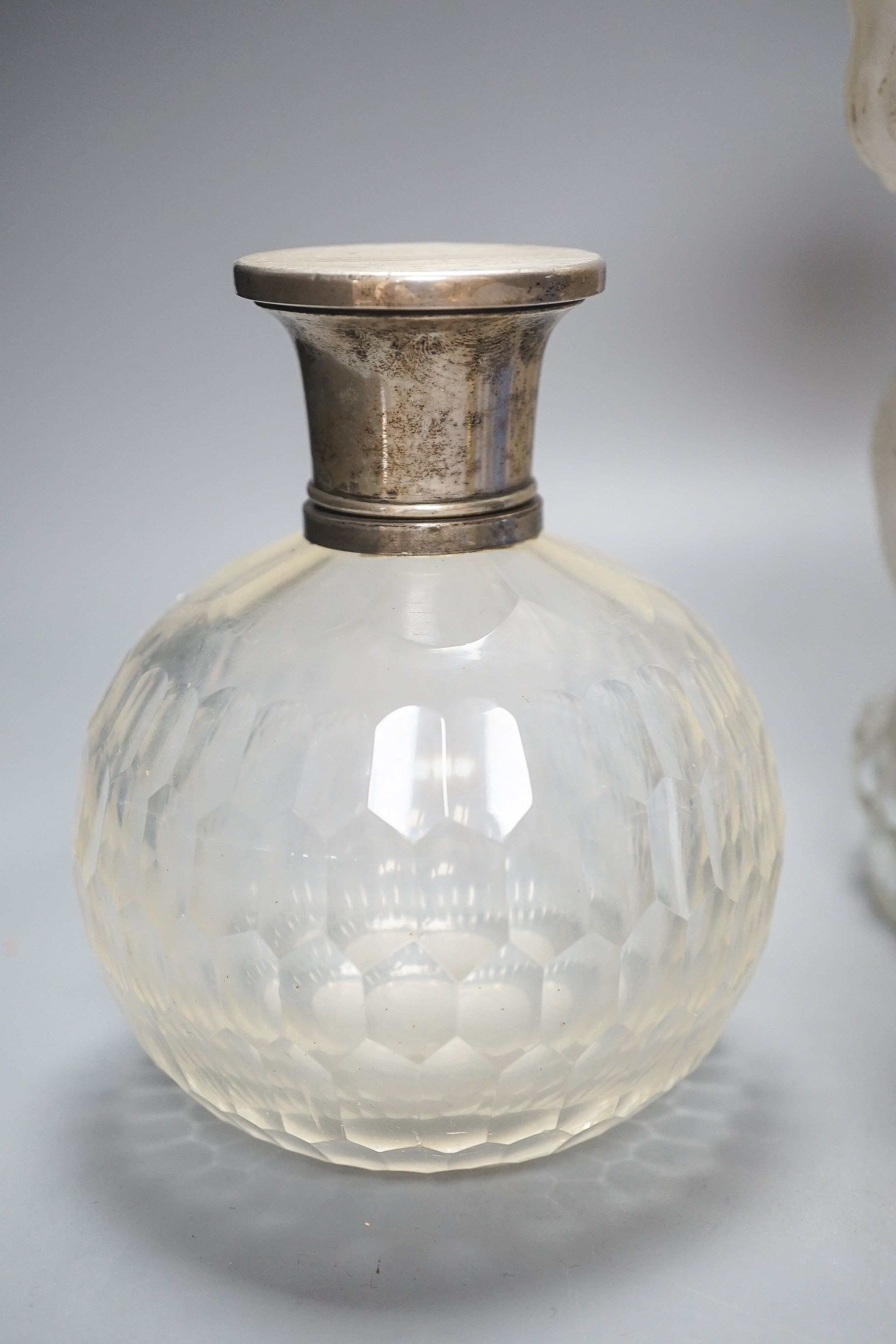 An American novelty dog decanter, silver topped perfume bottle, blue perfume bottle and three candy stripe bottles 32cm